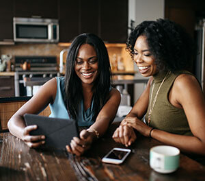 2 people looking at a tablet